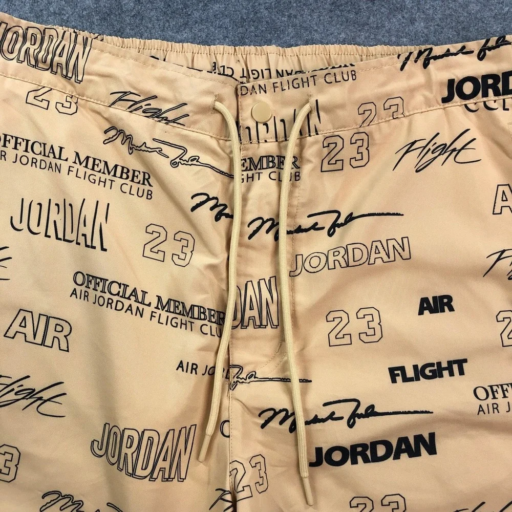 Jordan Mens Flight Club Shorts Medium Tan All-Over Print Graphic Drawstring